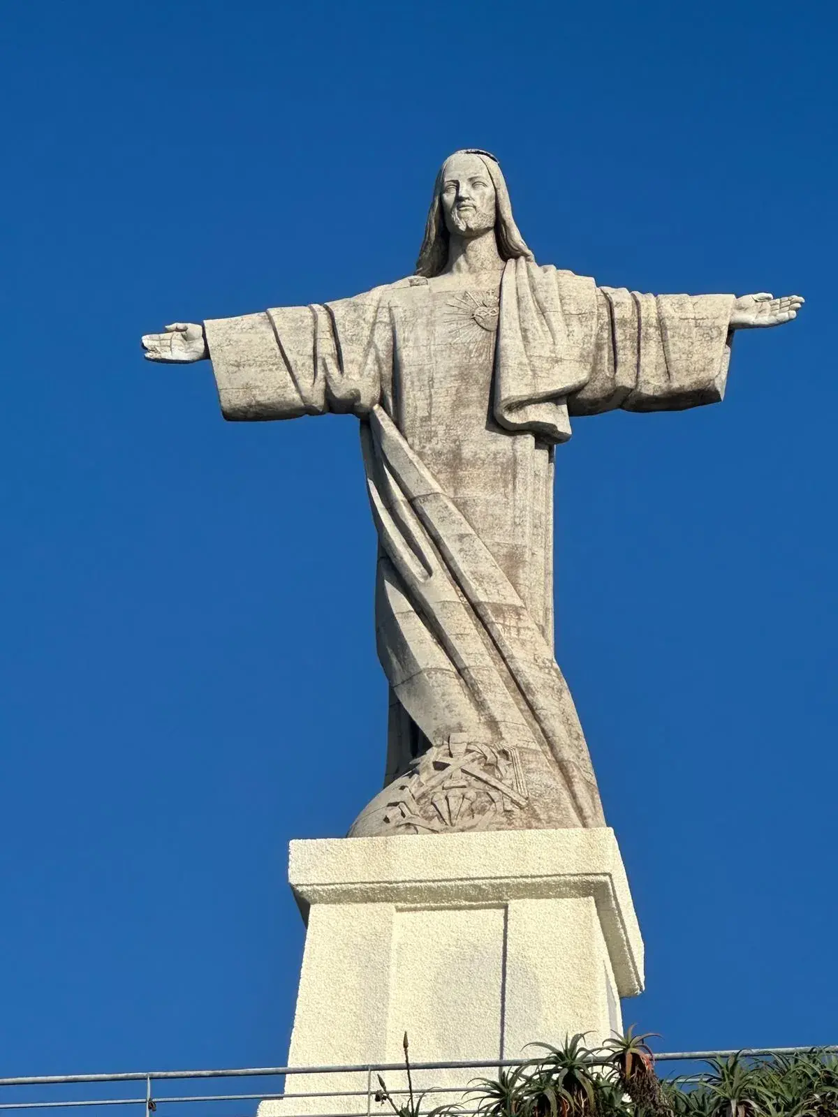 Cristo Rei statue against blue sky in Garajau