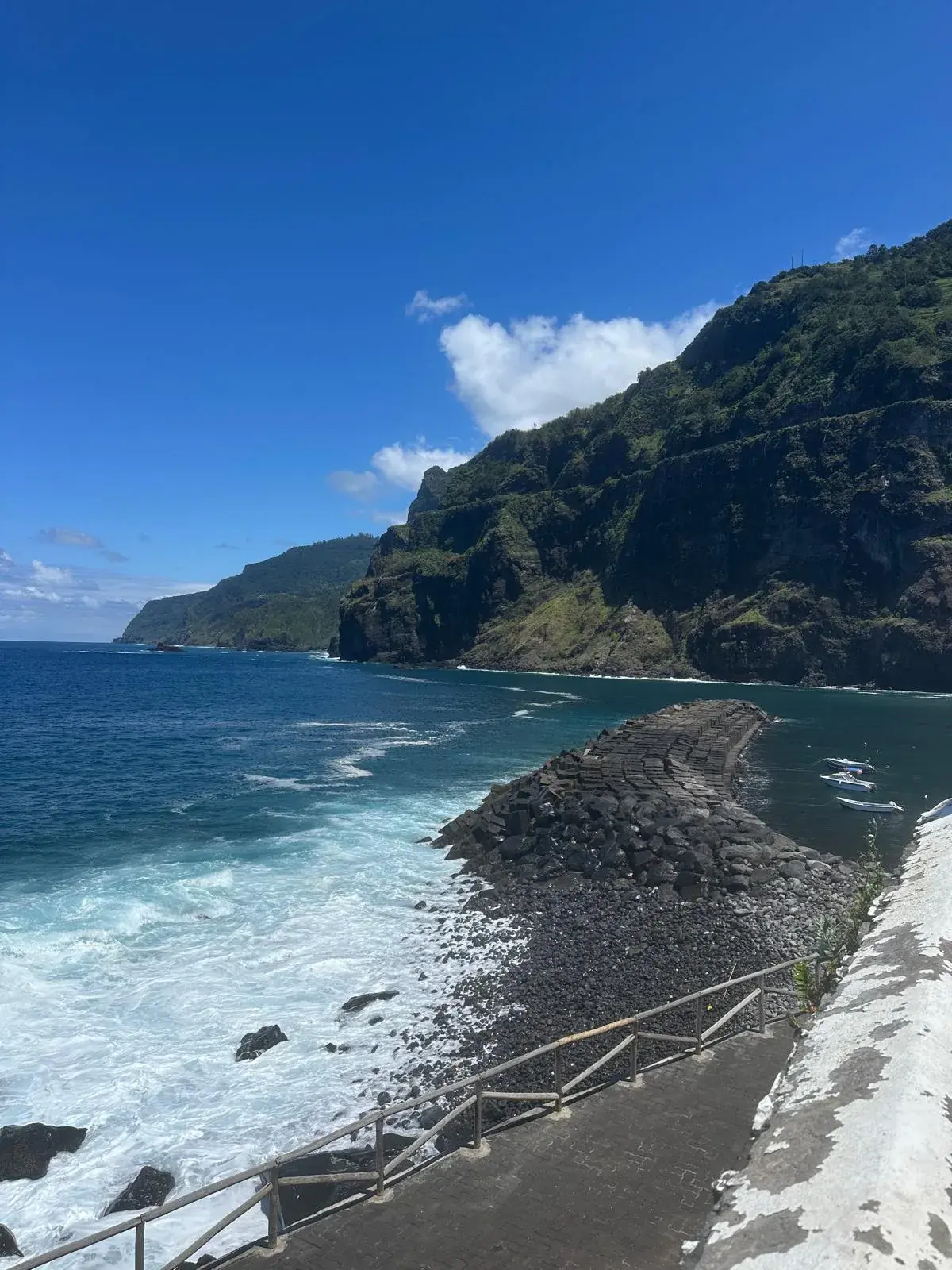 Rocky coast and harbour at Ponta Delgada, Madeira