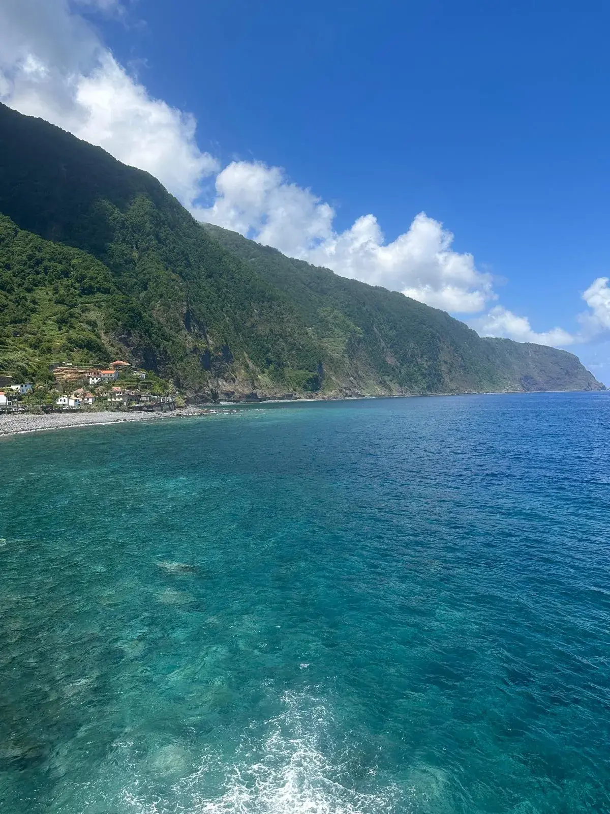 Clear Atlantic water and green cliffs at Seixal