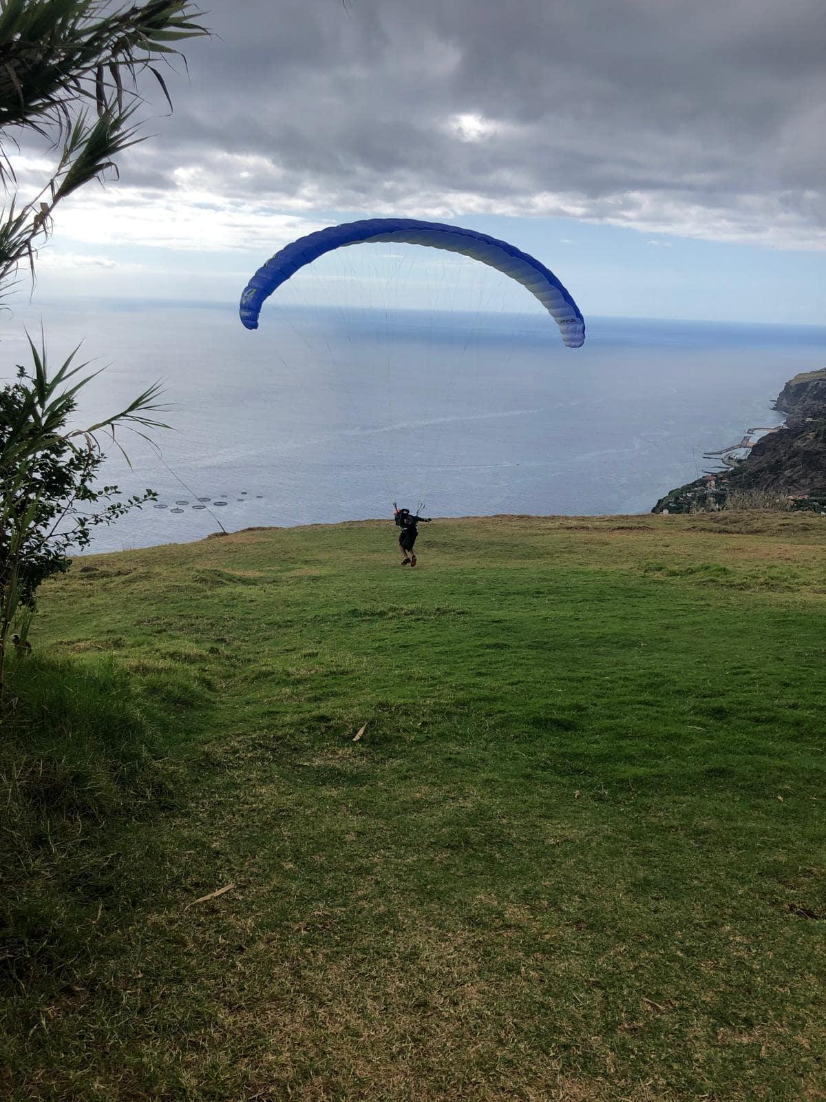 Tandem paragliding over the Atlantic coast near Calheta, Madeira