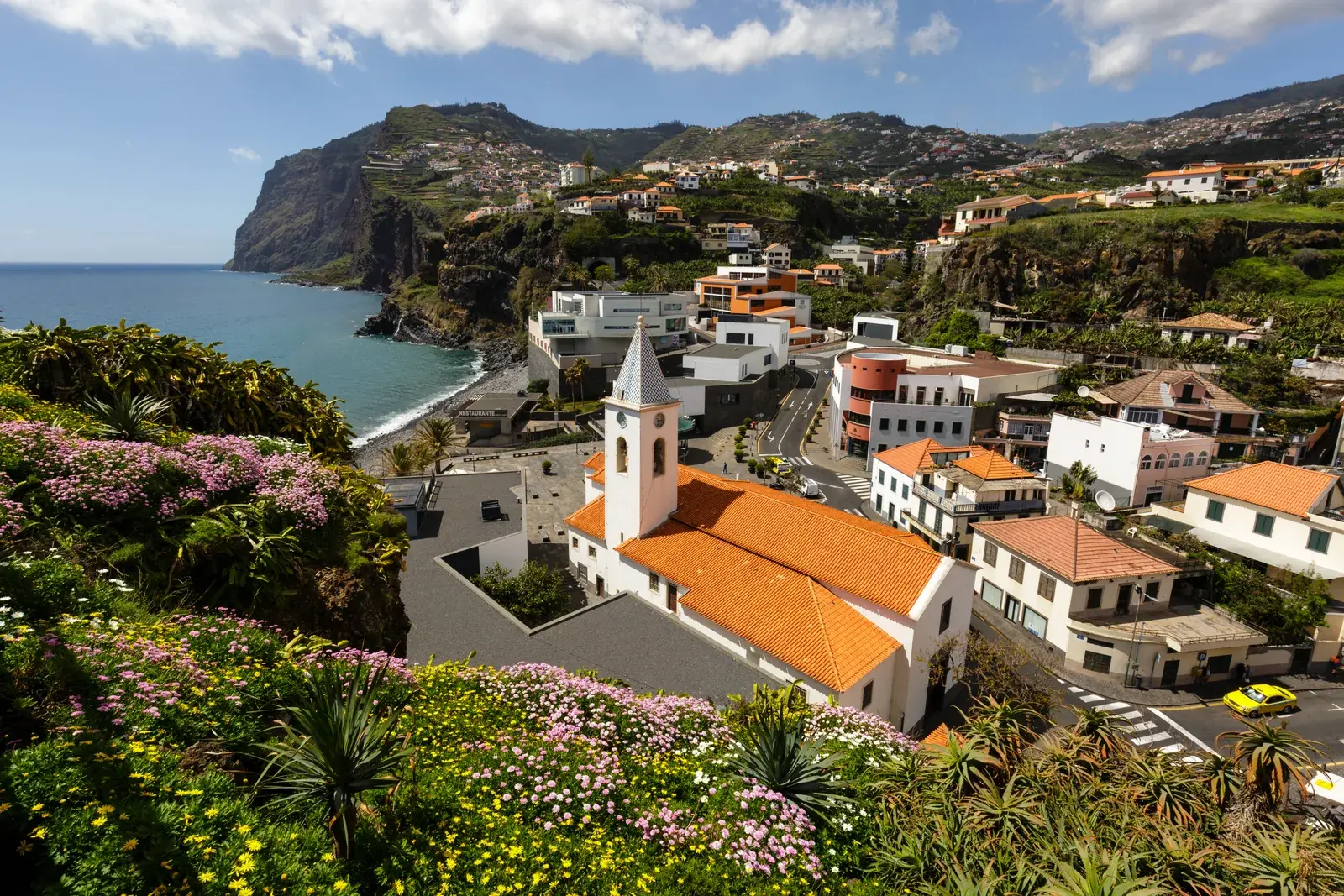 Câmara de Lobos church, coastline, and hillside homes on Madeira