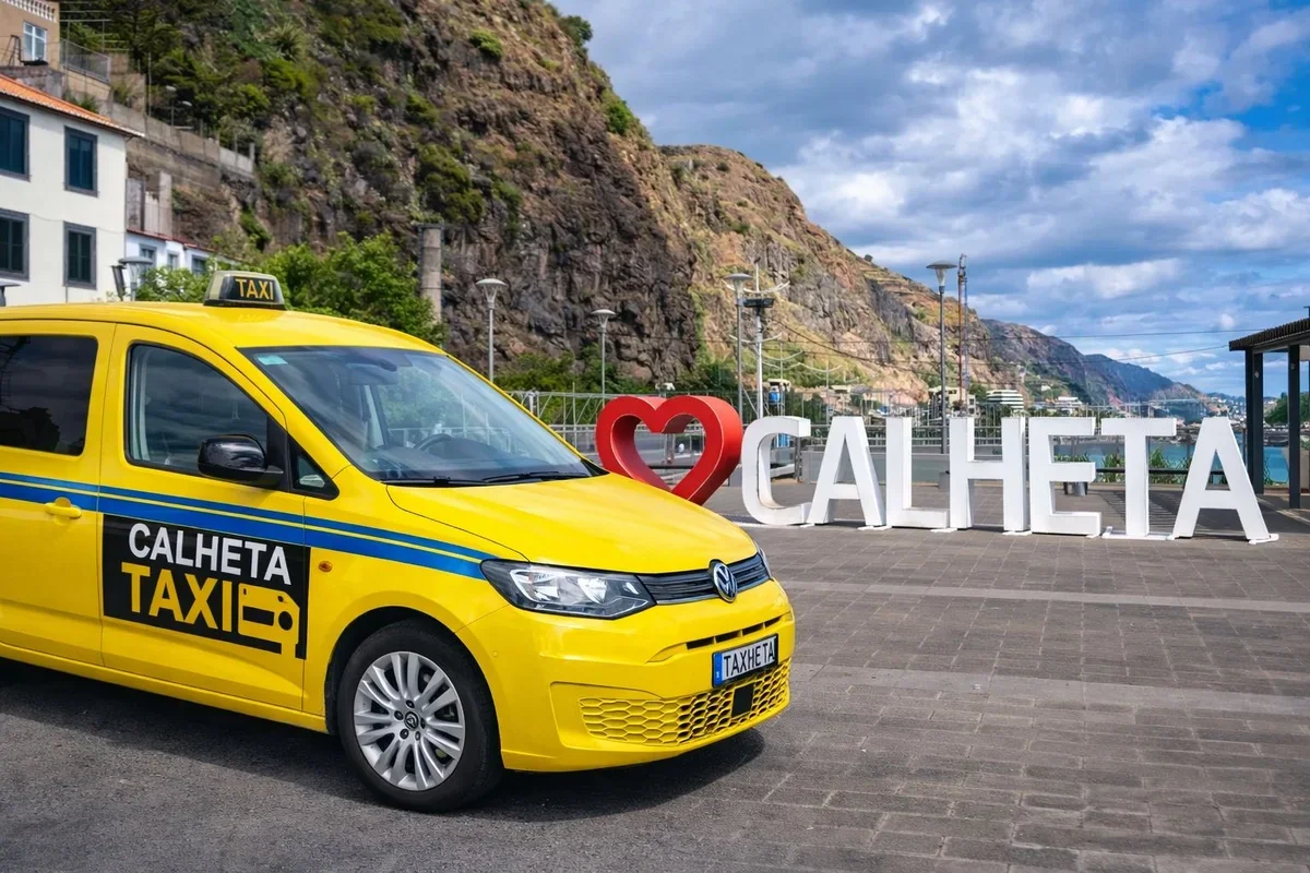 Calheta Taxi - Yellow taxi with scenic Madeira coastline